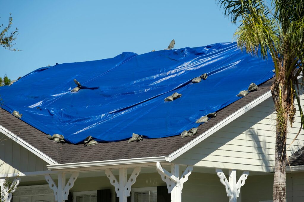 Tarping roofs to avoid leaks or intrusion of other debris